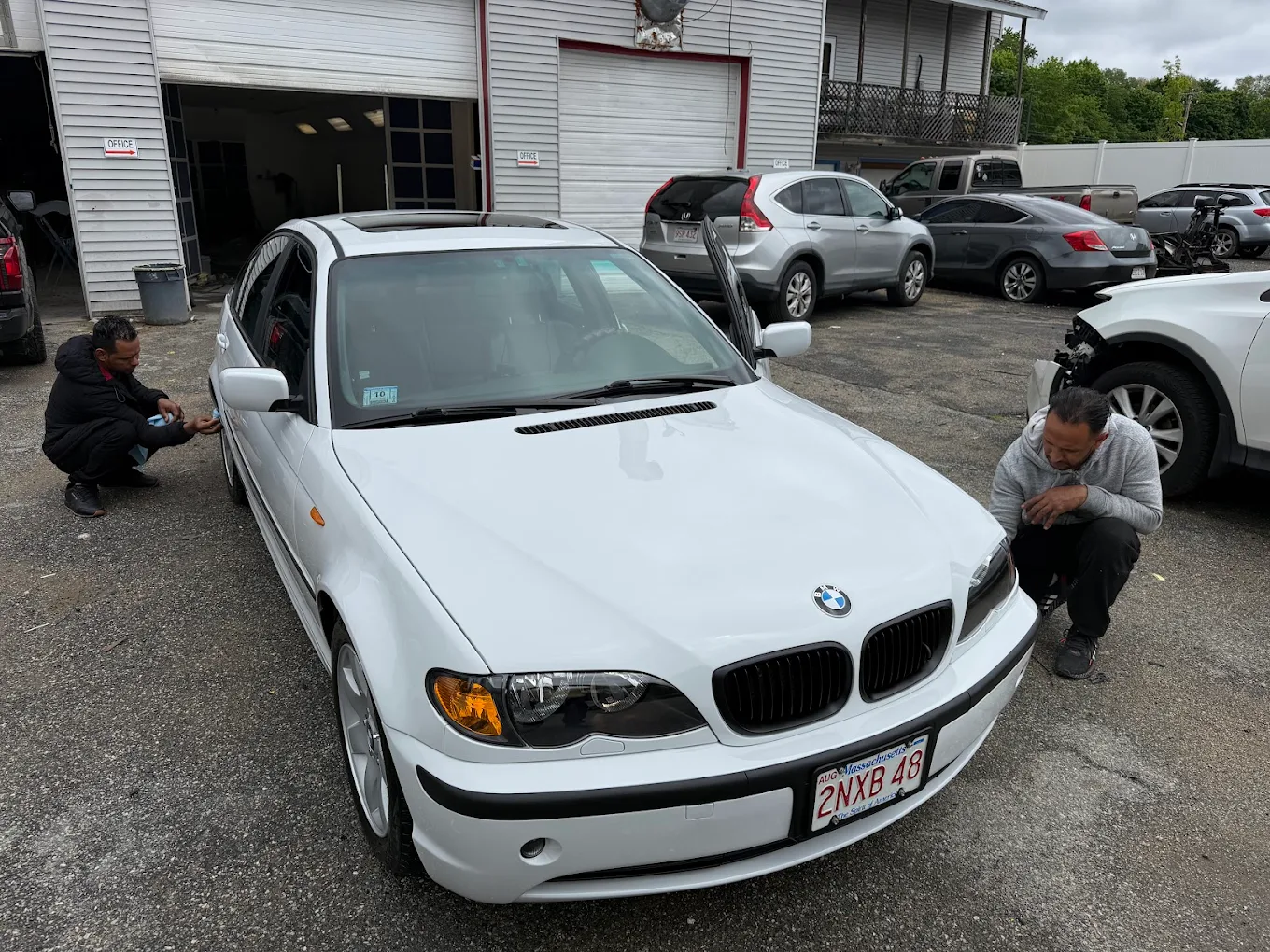 Before photo of BMW 325i being inspected by R&K Auto Body technicians in Haverhill MA